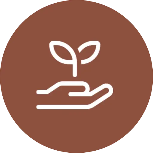 A brown circle with a hand holding a plant